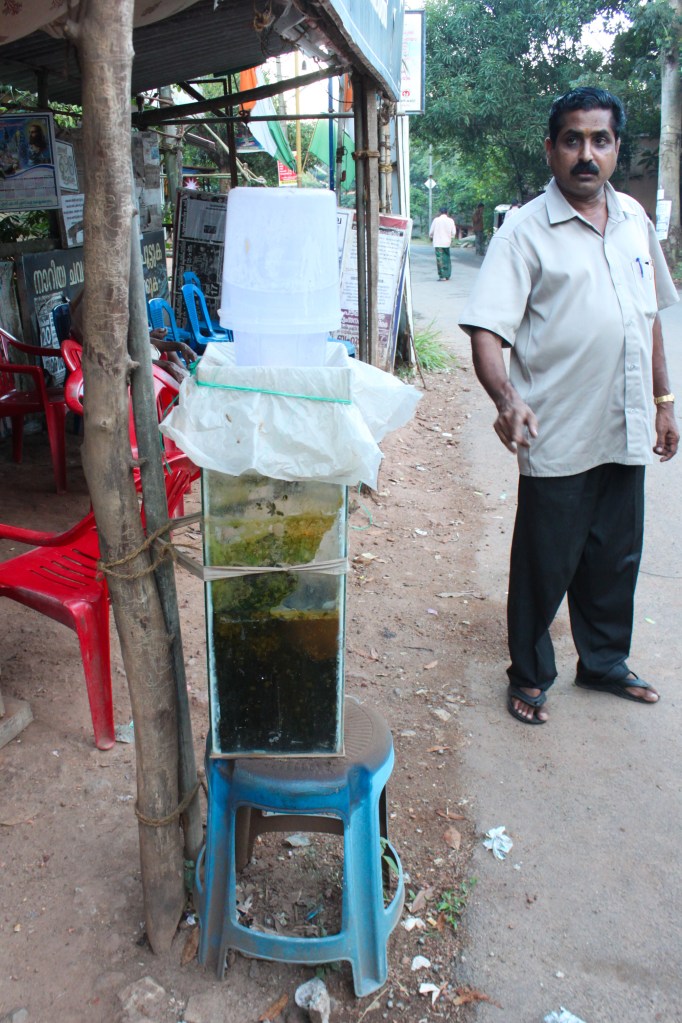 A Vilappilsala resident showcases leachate-polluted water from the river in Vilappilsala.