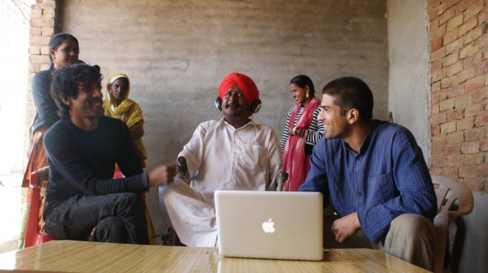 Taru Dalmia (left) with dalit musician and labor organizer Bant Singh (center). 